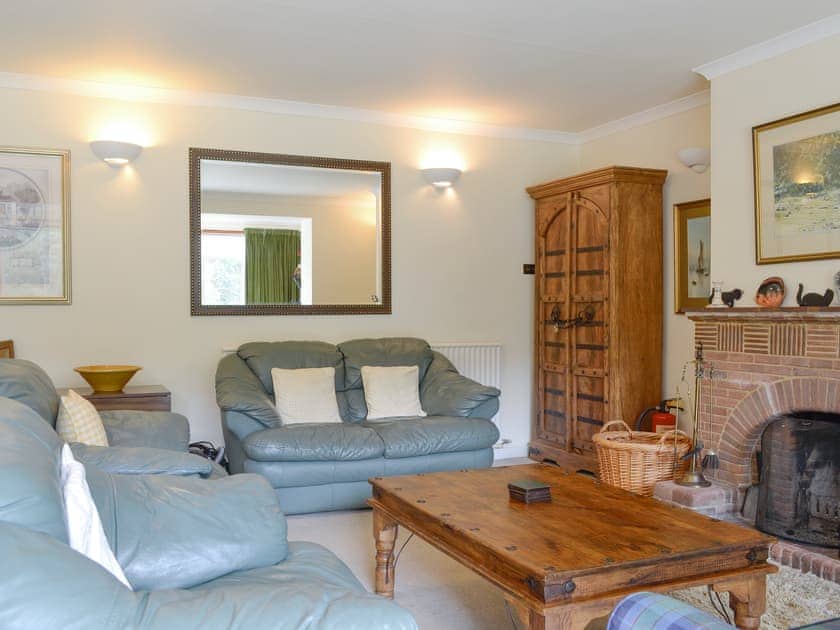 Comfortable living area with open-fire | Lairds Cast, Inchmarlo, Banchory