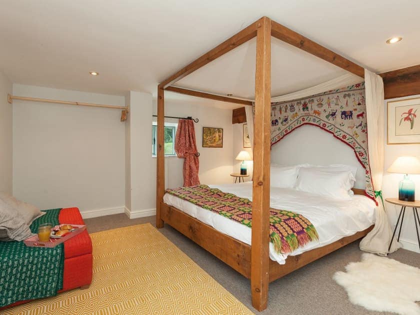 Relaxing en-suite four poster bedroom | Rhydleos Mill, Llansilin, near Oswestry
