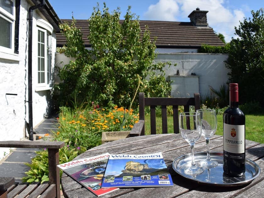 Lawned garden with paved patio area with garden furniture | Glasfor, Llansantffraed, near Aberaeron