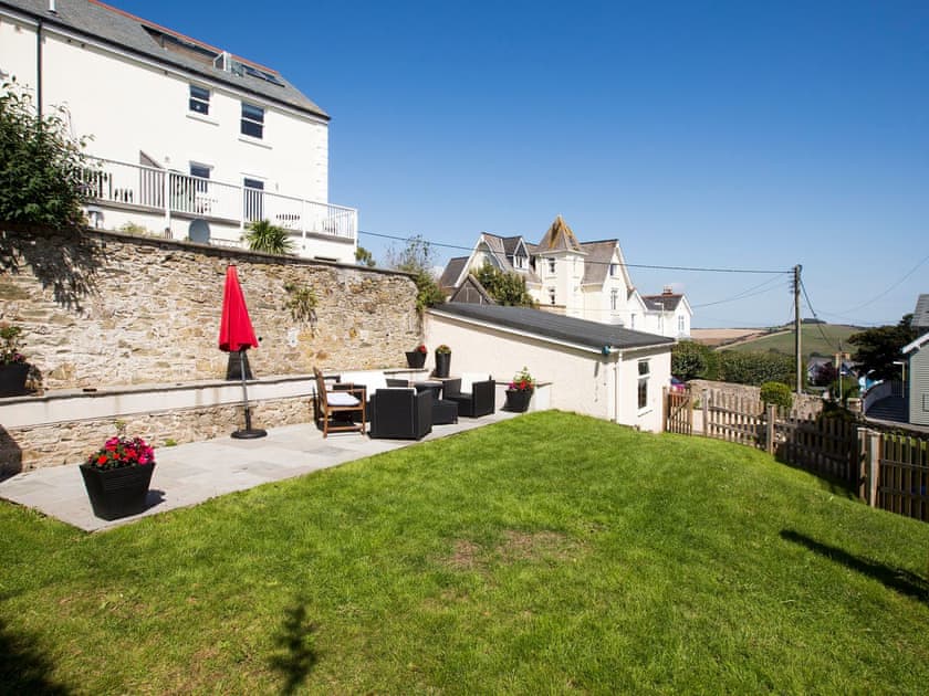 Rear lawn and paved terrace with furniture  | Innisfree, Salcombe