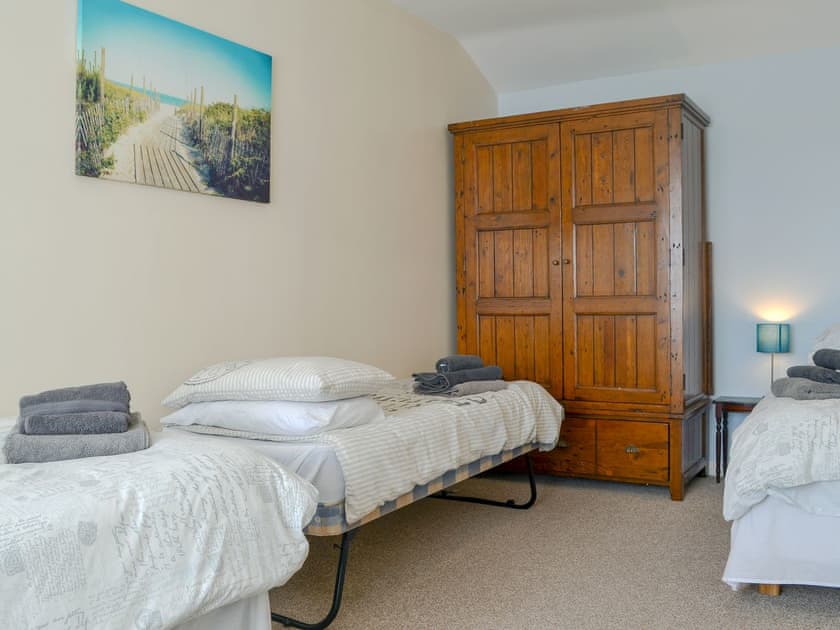 Large bedroom with three single beds | Penteryfn, near Holyhead, Isle of Anglesey