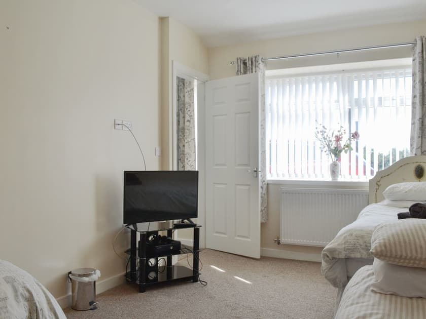 Large bedroom with three single beds | Penteryfn, near Holyhead, Isle of Anglesey