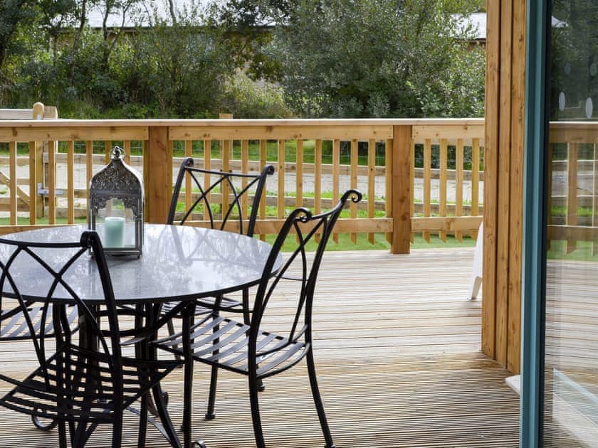 French doors leading to decked area | Eagle Owl Lodge, St Columb Major, near Padstow
