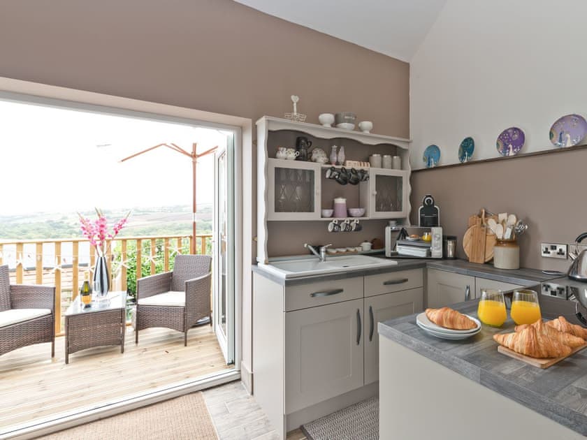 Kitchen area with outdoor dining space | Blackgill Lodge, Grinkle, near Easington