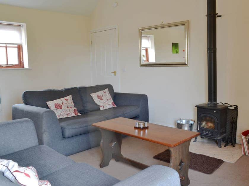 Comfy living area with wood burner | Partridge Cottage, Gristhorpe near Filey