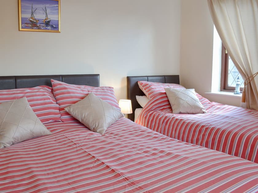 Bedroom with a kingsize bed, and a single bed  | The Bungalow, Lebberston, near Filey