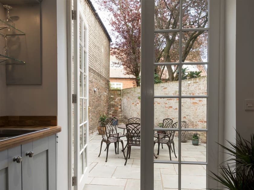 Patio doors leading onto an enclosed courtyard  | Beverley Minster House, Beverley