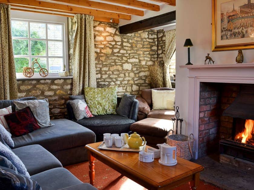 Comfortable living room with open fire | Chapel Lodge - Sands Farm Cottages, Wilton near Pickering