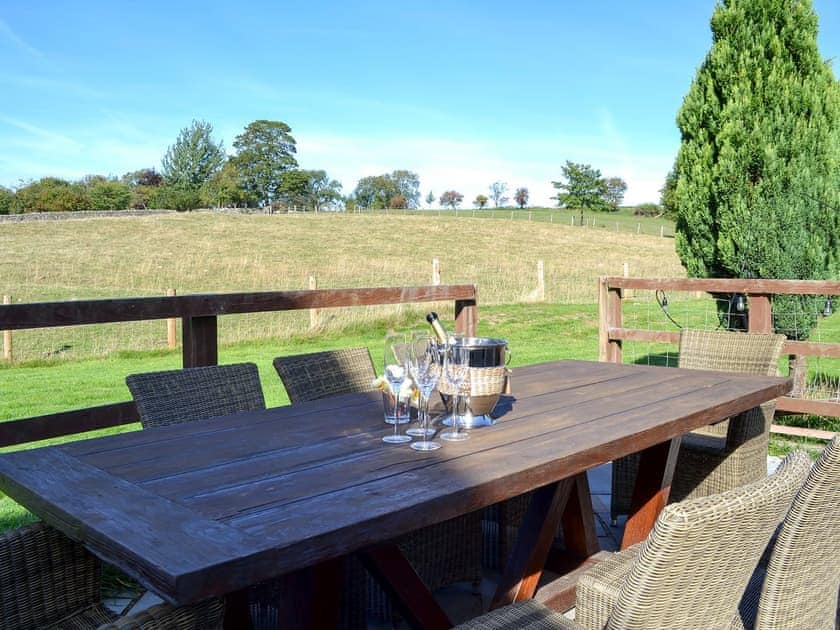 Enclosed decked patio with garden furniture and hot tub | Chapel Lodge - Sands Farm Cottages, Wilton near Pickering