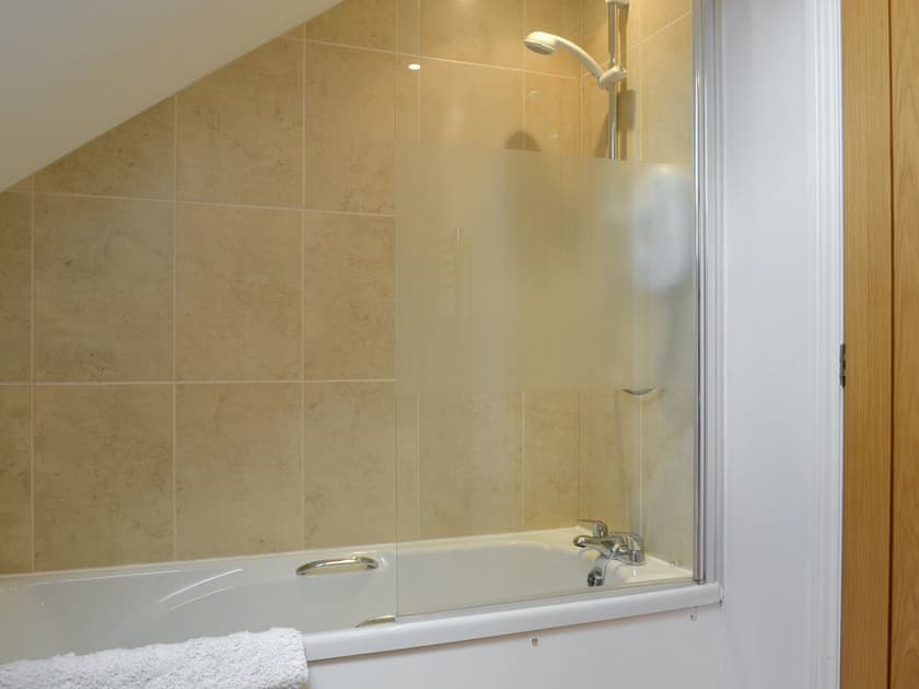 Bathroom with over the bath shower | Swallow Barn, Torpenhow, near Wigton