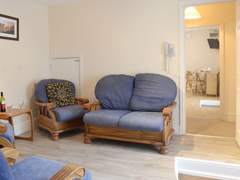 Comfy seating within sitting room | Paddock Cottage - Trimstone Manor Cottages, Trimstone, near Woolacombe