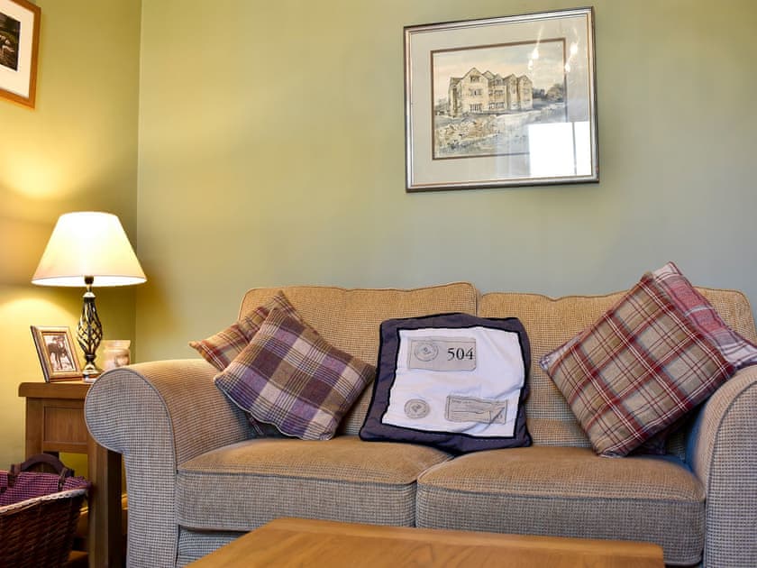 Cosy living room with wood burning stove | Spring Cottage, Carperby near Leyburn