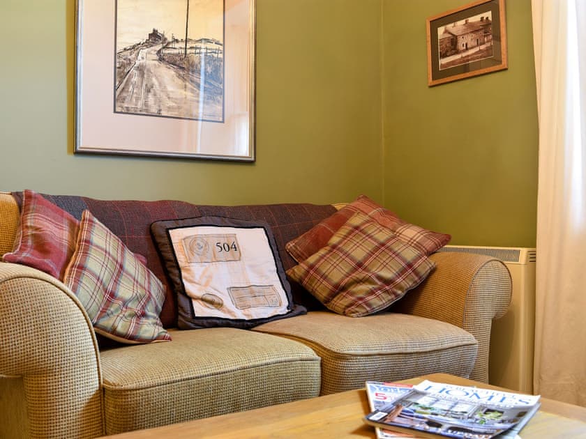 Cosy living room with wood burning stove | Spring Cottage, Carperby near Leyburn