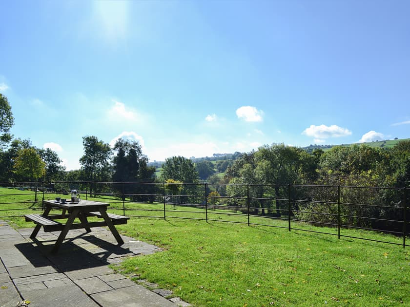Paved patio area with picnic style seating | Megs Cottage Butterton, Butterton, near Leek