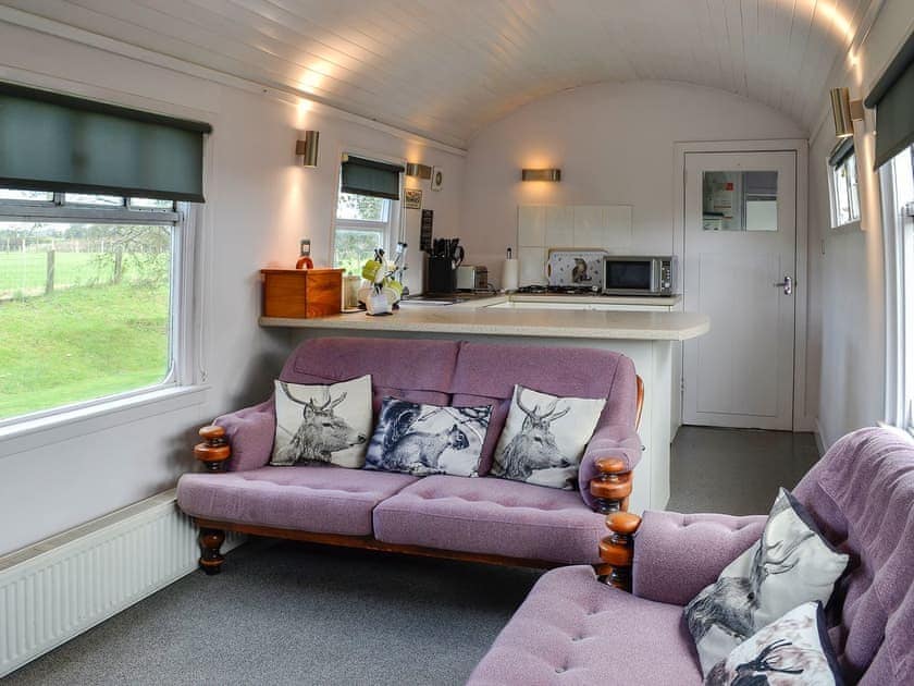 Living area with comfortable and cosy seats | The Carriage, Bridge of Dee, near Castle Douglas