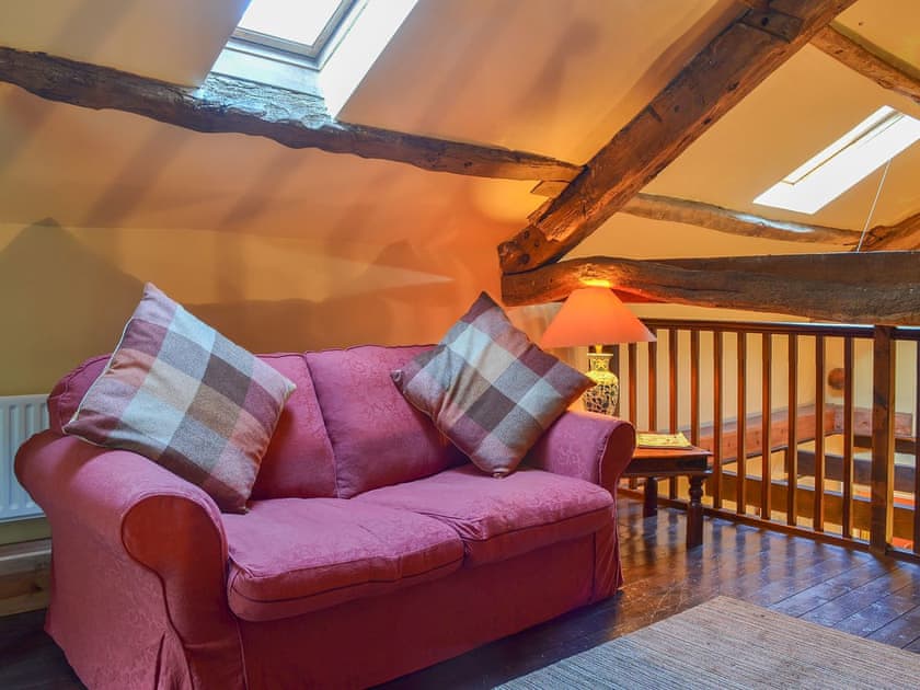 Comfortable sofa on the galleried landing | Birkerthwaite Barn - Birkerthwaite Cottages, Eskdale