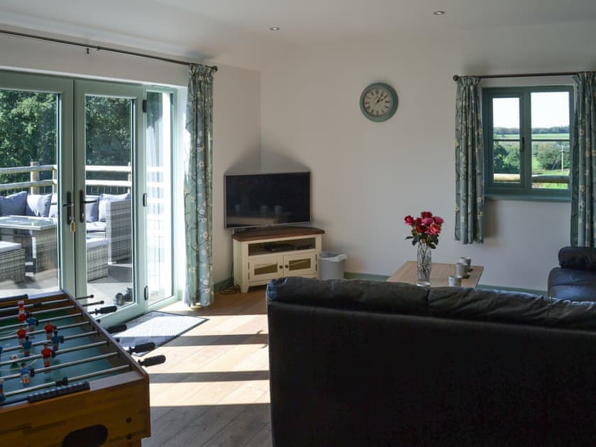 Sitting room with table football | East Croft Barn, Halwill, near Holsworthy
