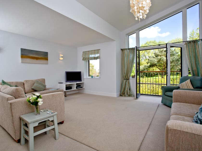 Spacious living area with Juliette balcomy | Nothe View - Admirals Quarter, Weymouth