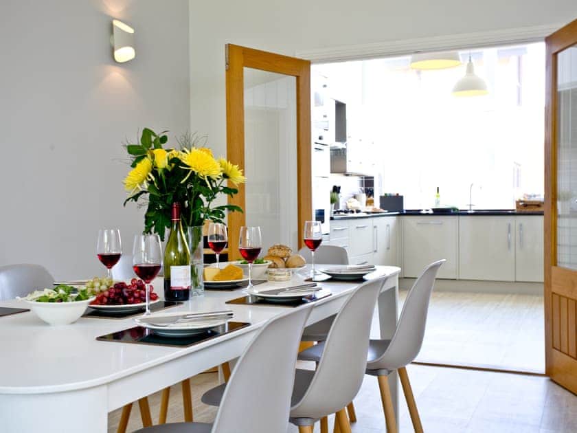 Dining area and adjacent kitchen | Nothe View - Admirals Quarter, Weymouth