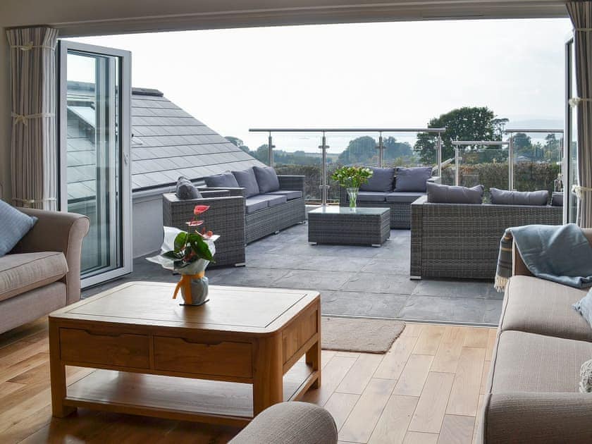 Sunny terrace straight rfom the living area | Estuary View, Exmouth