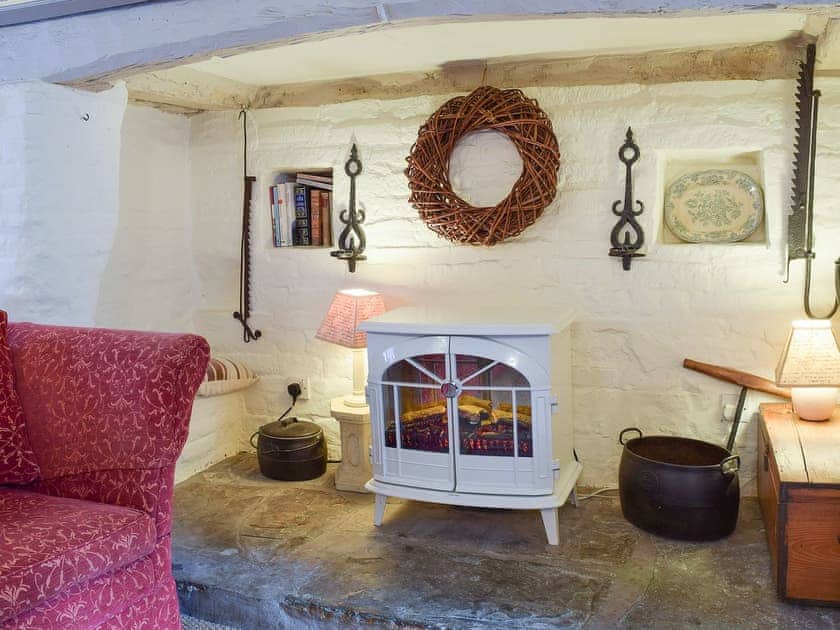 Relax in the cosy living room by the electric wood burner | Hathaway Hamlet, Stratford-upon-Avon