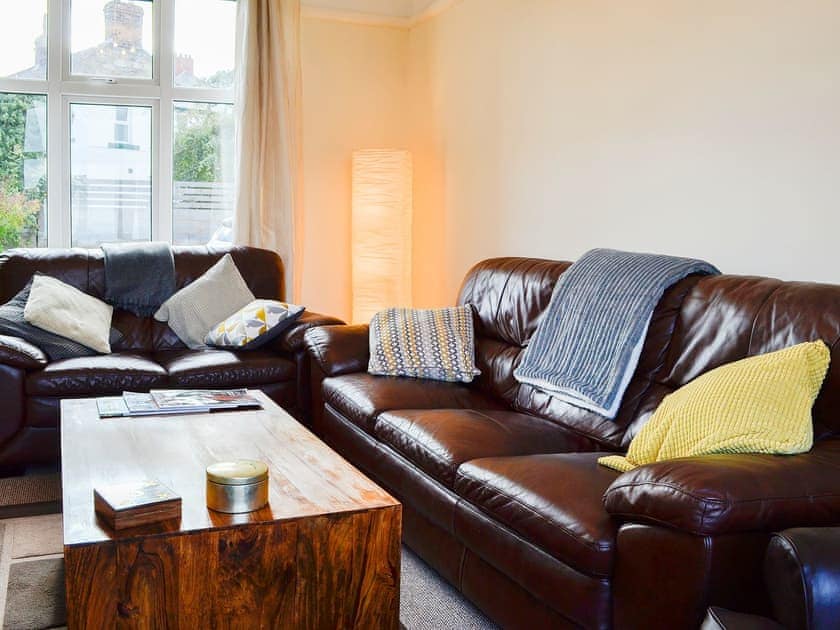 Comfortable leather sofas in the living room | Zonnebloem, Brymbo, near Wrexham