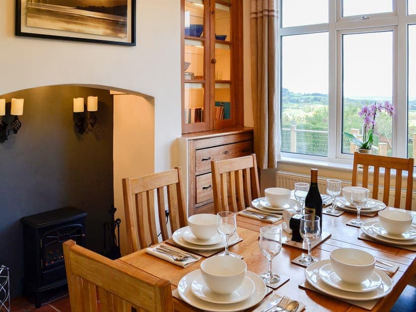 Delightful family dining room with electric coal effect fire | Zonnebloem, Brymbo, near Wrexham