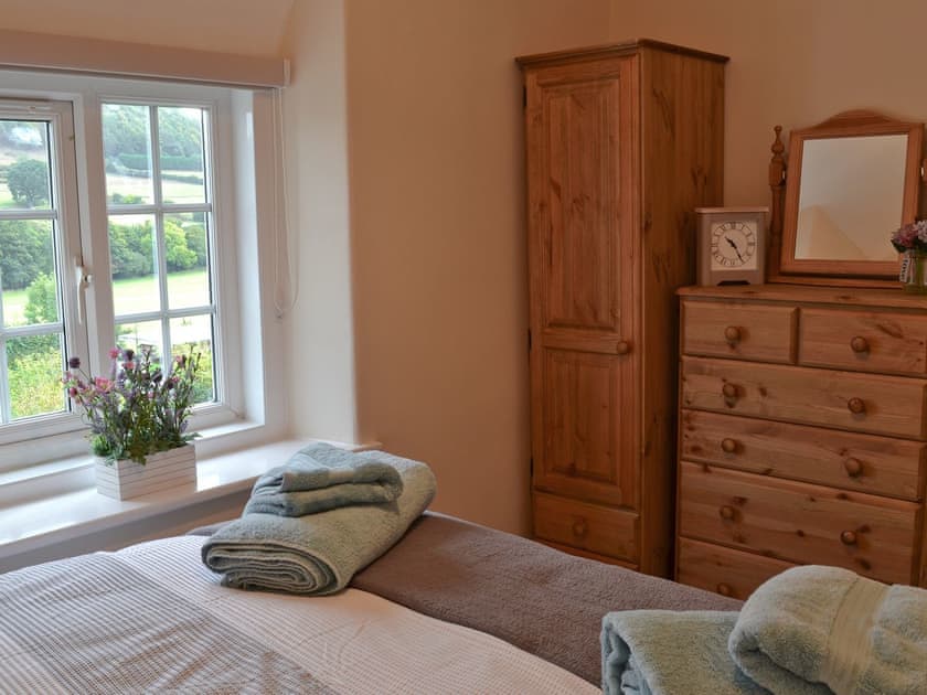 Double bedroom with great views through the window | Derwent Cottage, Wrench Green, near Scarborough