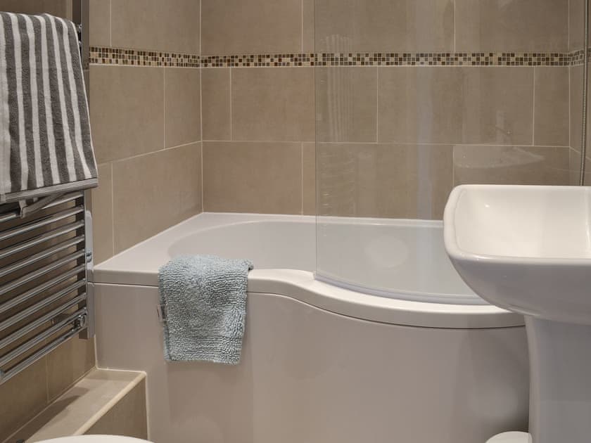 Bathroom with shower over bath | Derwent Cottage, Wrench Green, near Scarborough