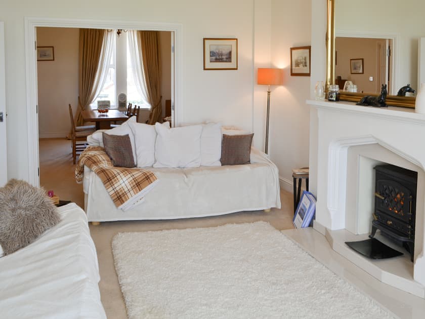 Living room with double doors to the dining room | Bay View, Whitley Bay