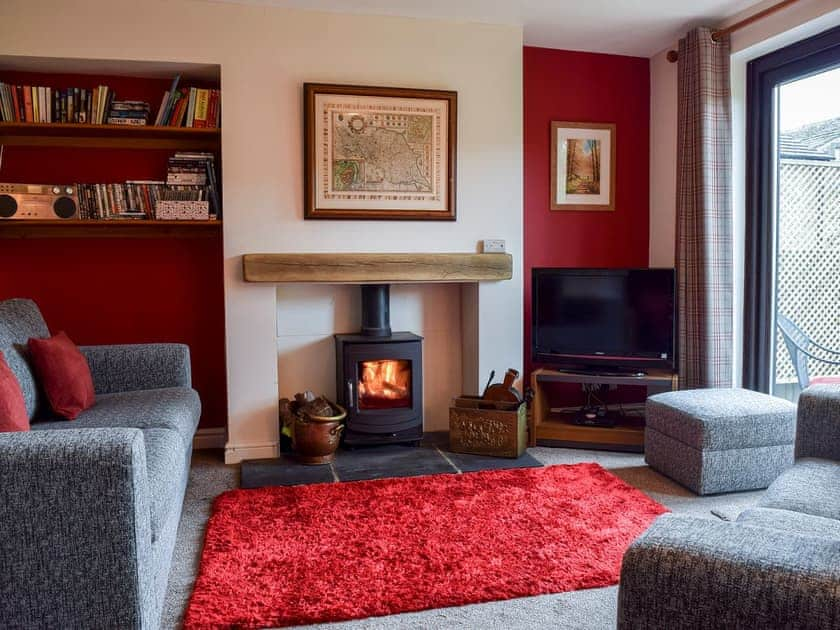 Tastefully furnished living room with patio doors  | Fell View, Kettlewell, near Buckden