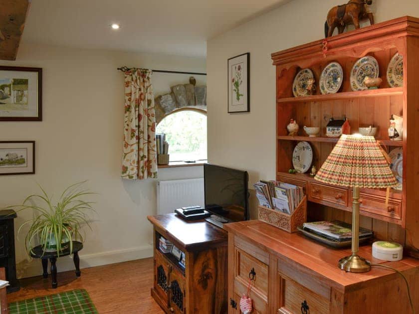Living room with TV | Bryn Dedwydd Cottage, Eryrys, near Mold