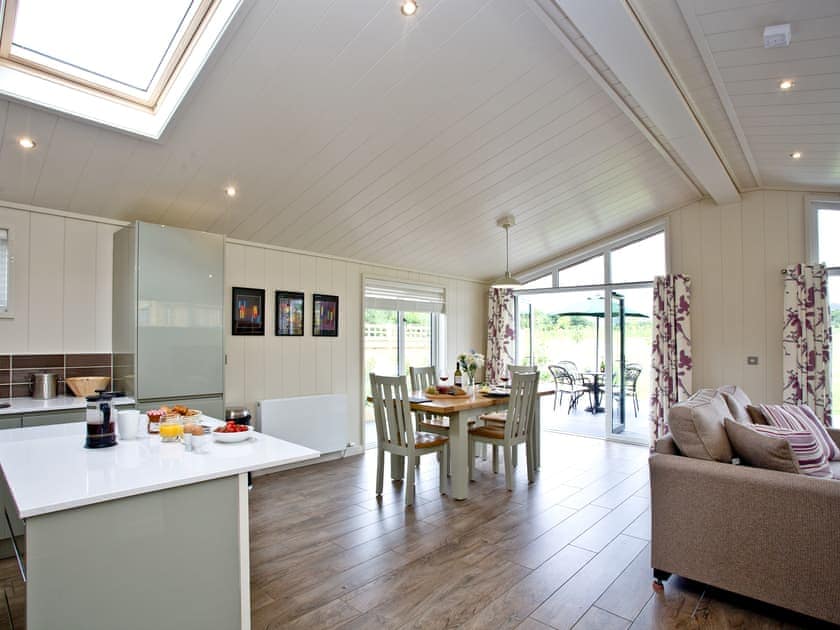 Kitchen breakfast bar overlooking the living and dining areas | Holly Lodge - South Downs Lodges, Hassocks