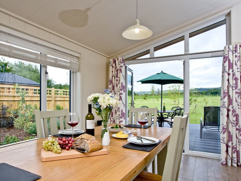 Dining area with views over the surrounding area and garden | Holly Lodge - South Downs Lodges, Hassocks