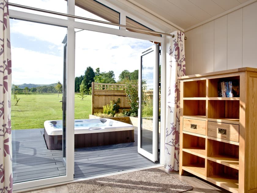 Doors to the decking with wonderful sunken hot tub | Holly Lodge - South Downs Lodges, Hassocks
