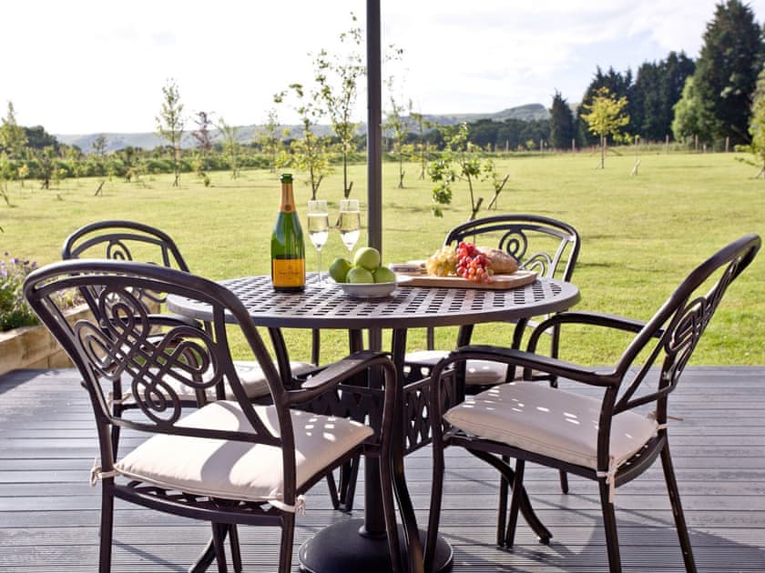 Decked area with patio furniture | Holly Lodge - South Downs Lodges, Hassocks