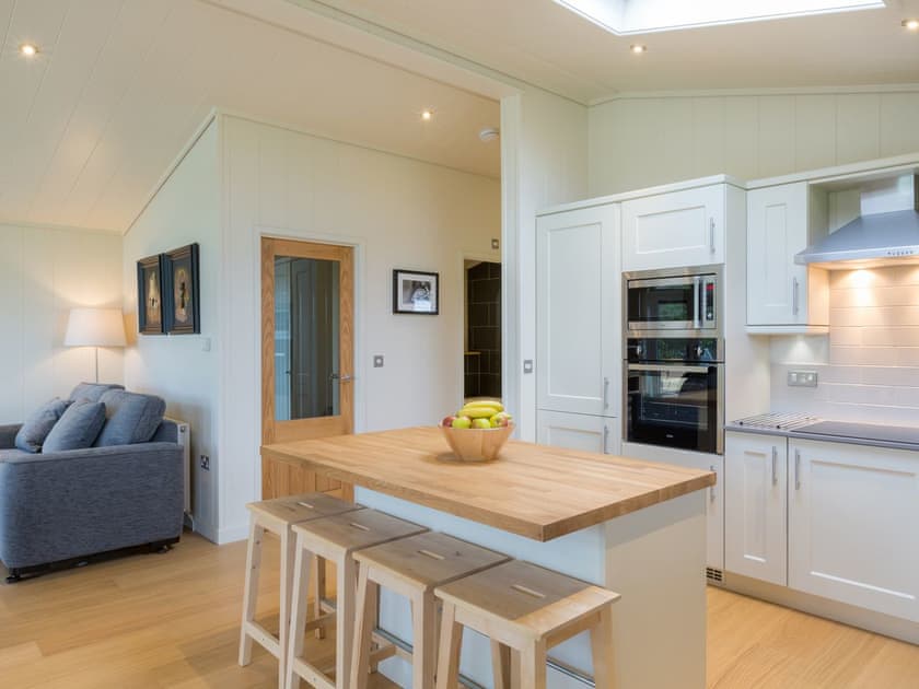 Kitchen area with island breakfast bar | Maple Lodge - South Downs Lodges, Hassocks