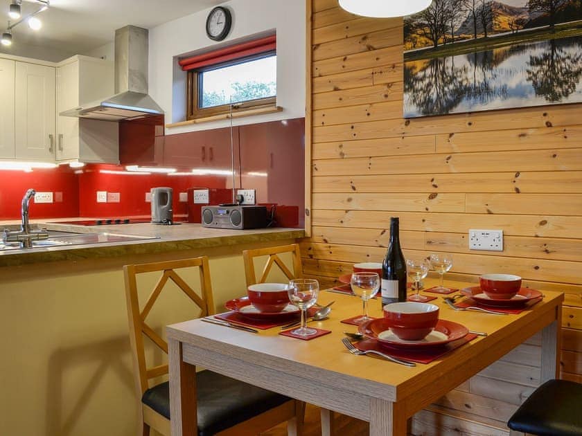 Dining area and adjacent kitchen | Knock Murton Lodge - Gatra Farm Lodges, Lamplugh, near Cockermouth