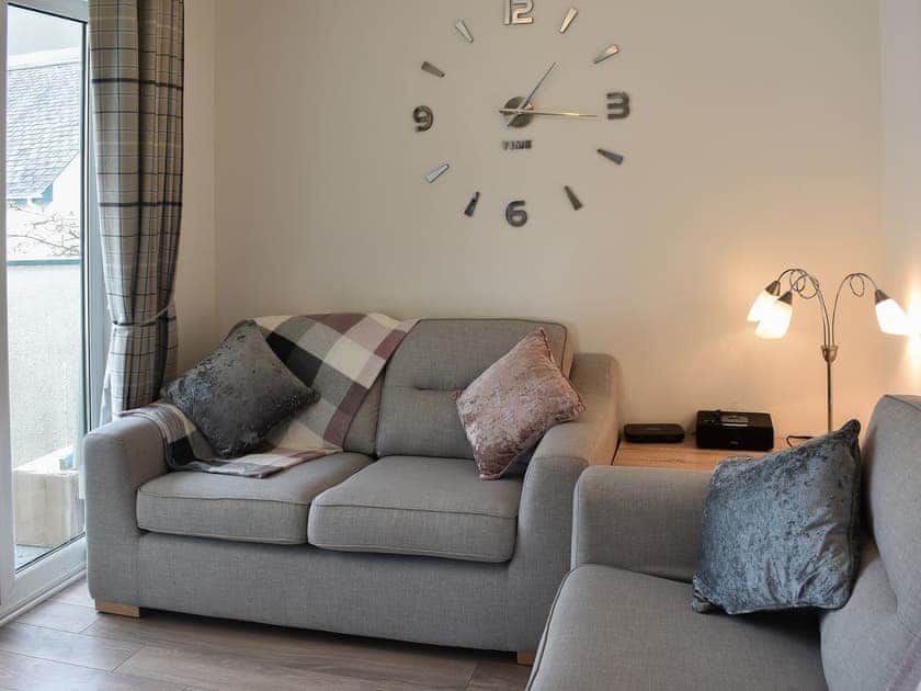Comfortable living area with balcony access | Claife View, Bowness-on-Windermere