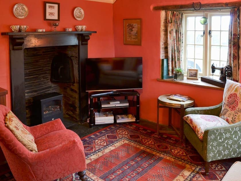 Warm and cosy living room with log effect electric fire | Downhouse - Downhouse Cottages, Trebarwith, near Delabole
