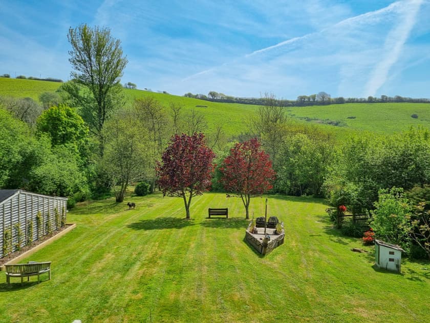 Large lawned garden with sitting-out area and garden furniture | Bluebell - Kilbol Country Cottages, Polmassick, near St Austell