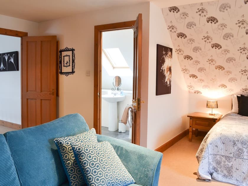 Double bedroom with seating area and en-suite | Croftside House - Allt Mor Cottages, Aviemore