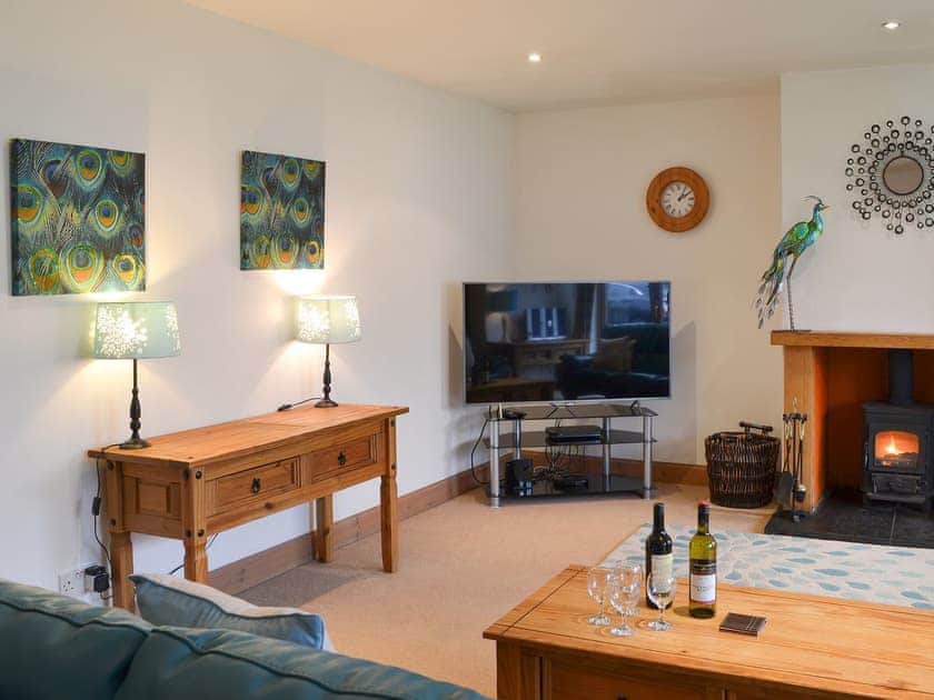 Warm and comfortable living room with woodburner | Cairn View - Allt Mor Cottages, Aviemore