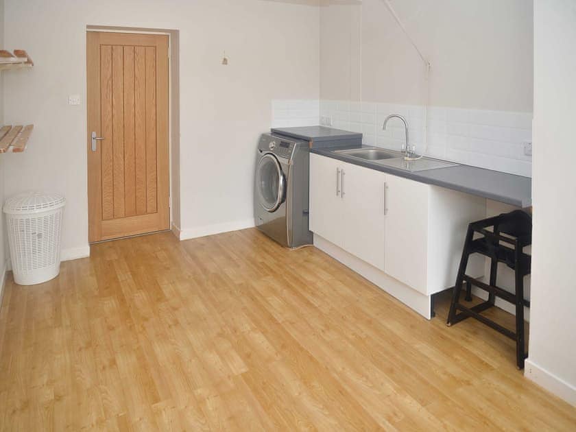 Prectical utility room with laundry facilities | Loramore, Aviemore