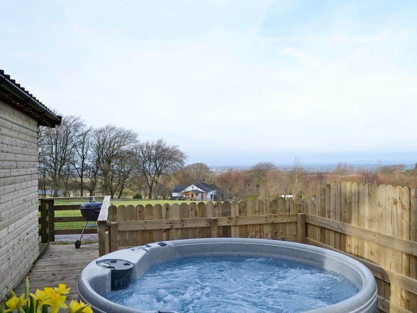 Relaxing hot tub boasting wonderful views | Kestrel Cabin - Wallace Lane Farm Cottages, Brocklebank, near Caldbeck and Uldale