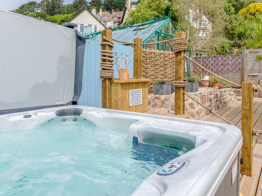 Relaxing private hot tub | Stone Barn - Vicarage Road Holiday Cottages, Minehead