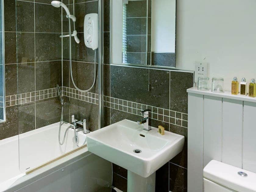 House bathroom, with hand shower and electric shower overhead | The Gatehouse, Ambleside