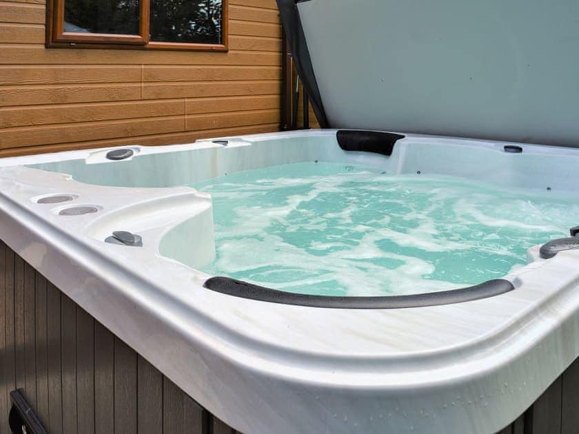 Relax in the private hot tub | Ysgubor FadogEin Yfory, Brynteg, near Benllech