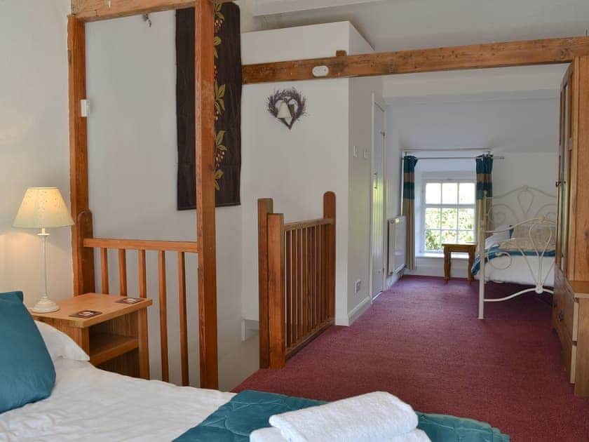 Comfortable bedroom with a double and single bed | Cosy Nook, Ambleside