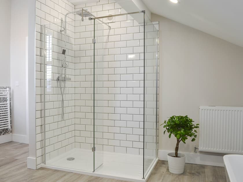 House bathroom features a bath and separate shower cubicle | The Station House - Station House Cottages, Upper Poppleton, near York